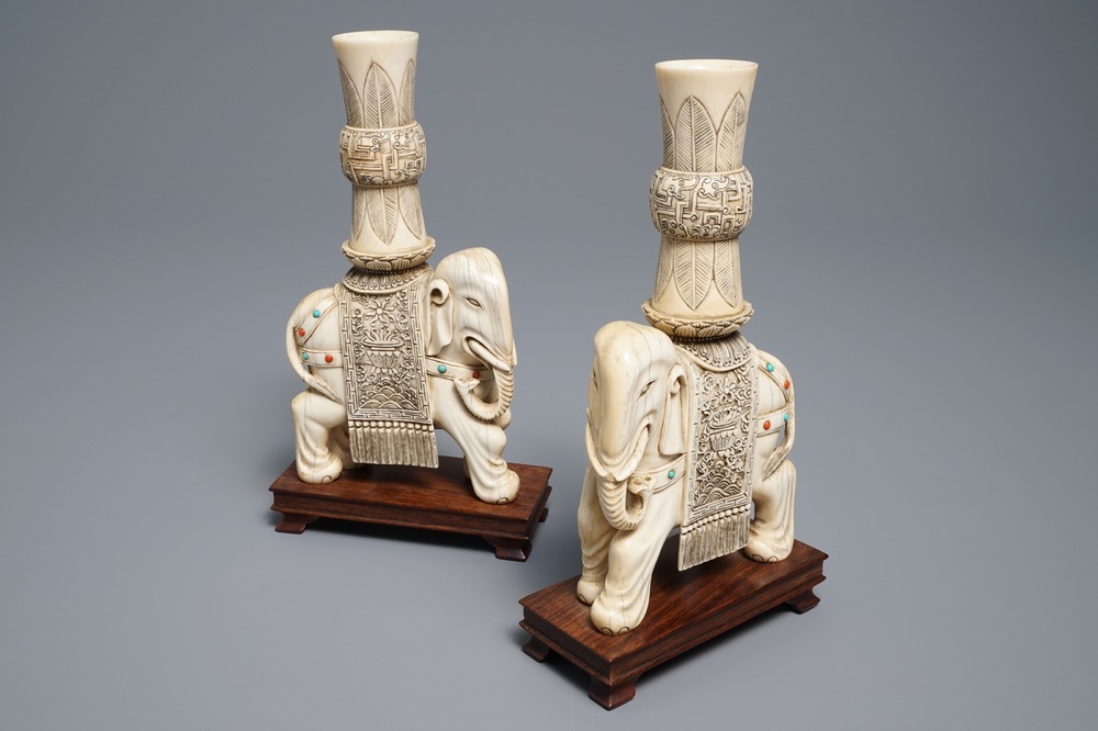 A pair of Chinese coral- and turquoise inlaid ivory elephant candlesticks, 19th C.