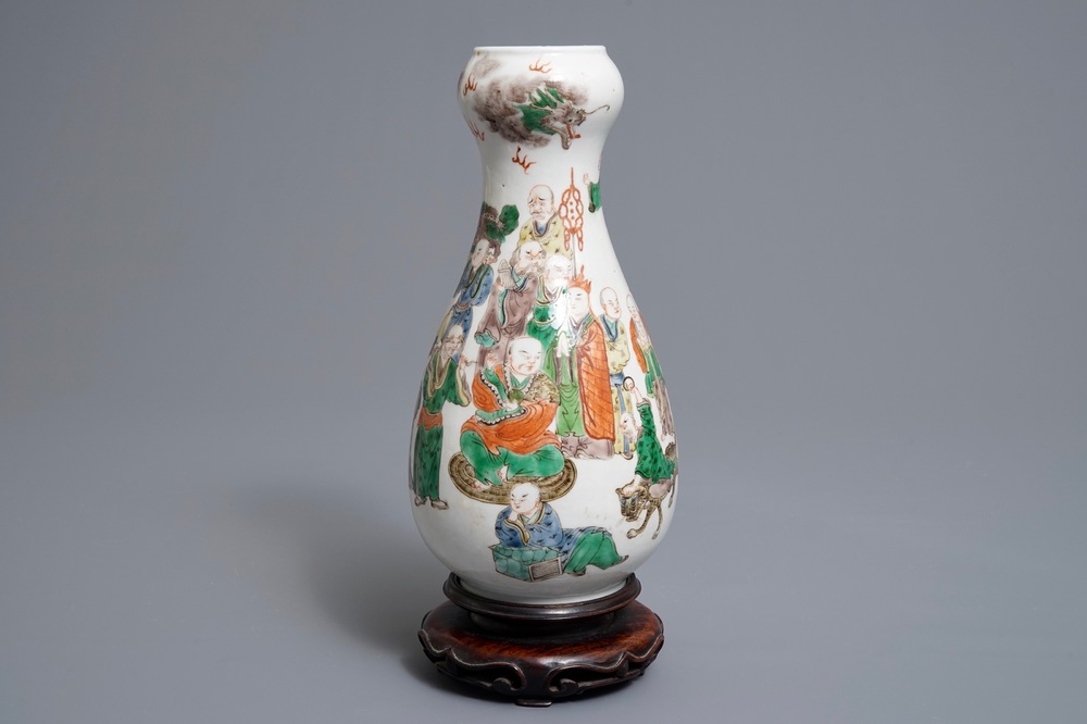 A Chinese famille verte pear-shaped bottle vase with Luohans, 19th C.