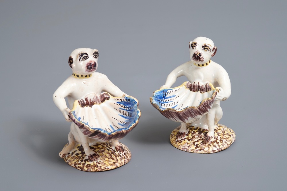 A pair of polychrome Brussels faience monkey-shaped salts, 18th C.