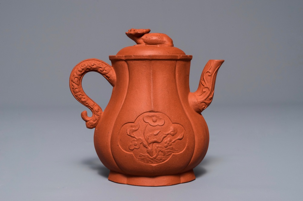 A Chinese Yixing stoneware wine jug with applied flowers and buffalo, Kangxi