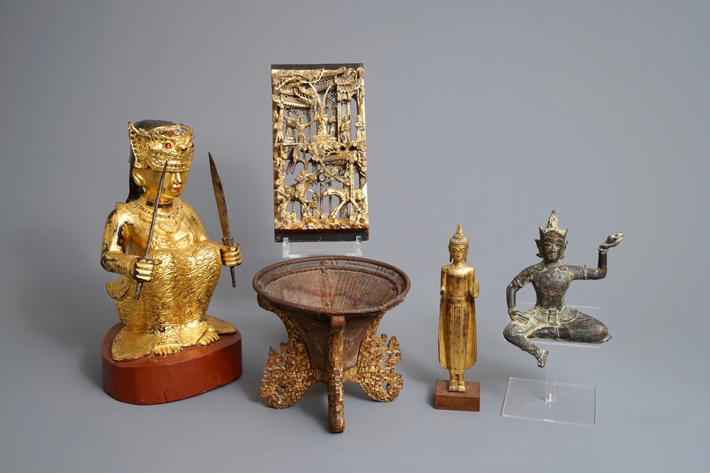 A varied collection of gilt wood carvings, a basket and a bronze figure, China and Southeast Asia, 19/20th C.