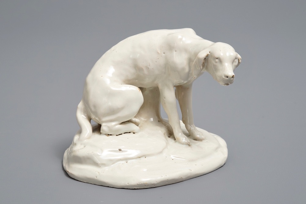 A white Dutch Delft model of a dog, 18th C.