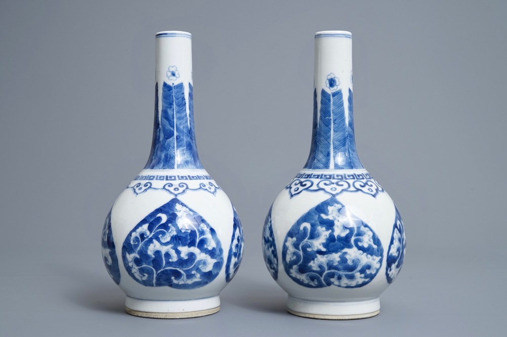 A pair of Chinese blue and white bottle vases, Kangxi mark, 19/20th C.