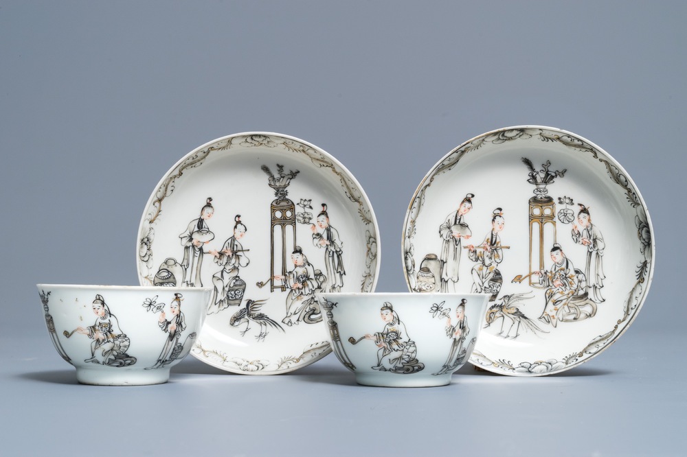A pair of Chinese grisaille and gilt cups and saucers, Qianlong