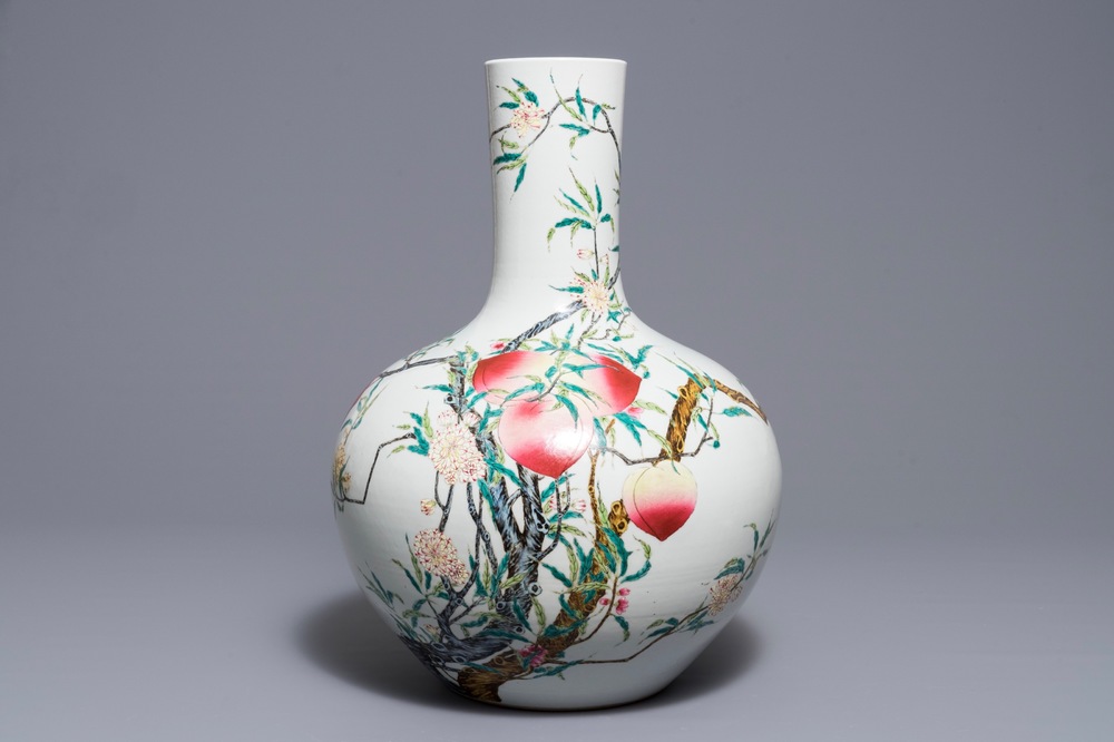 A Chinese famille rose &lsquo;nine peaches&rsquo; tianqiu ping vase, Qianlong mark, 20th C.