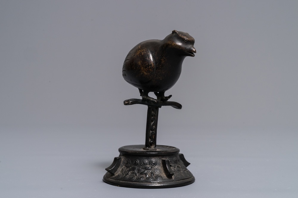 A Chinese bronze water dropper in the shape of a perched bird, Ming