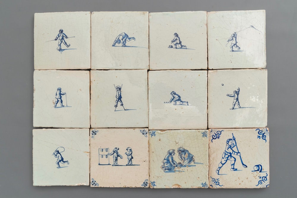 Twelve Dutch Delft blue and white tiles with children at play, 17th C.