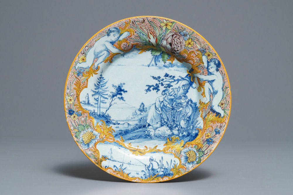 A fine polychrome mixed technique Dutch Delft 'pastoral' plate, 18th C.