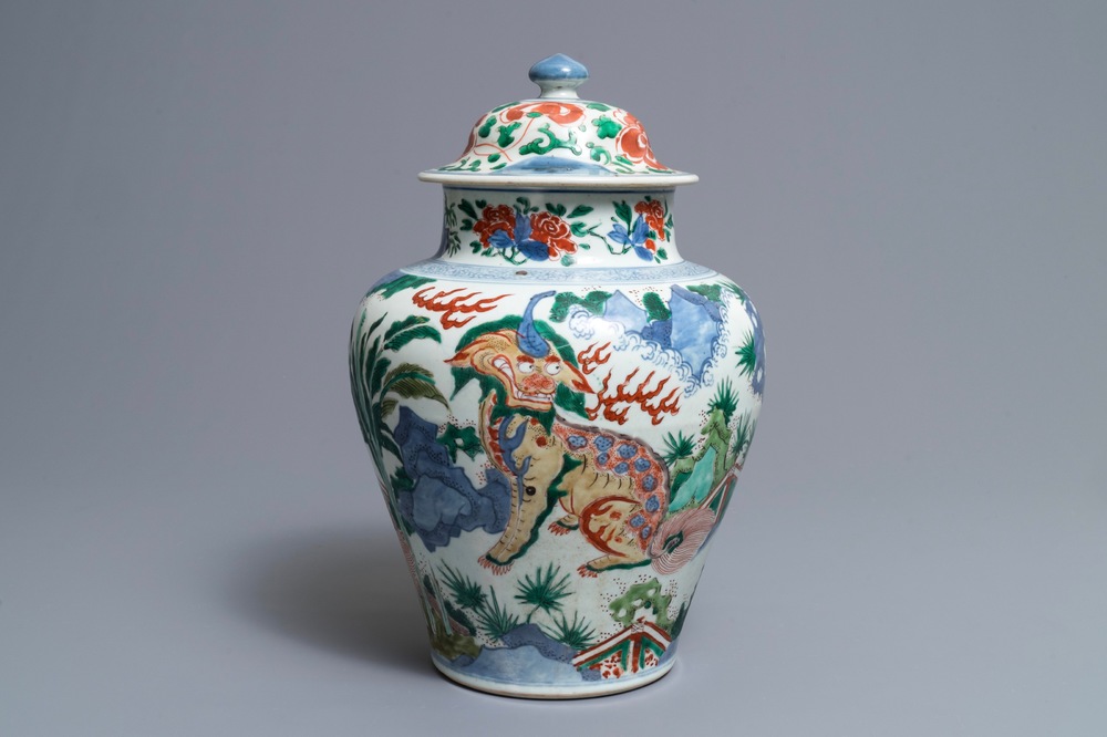 A Chinese wucai &lsquo;mythical beasts&rsquo; vase and cover, Transitional period