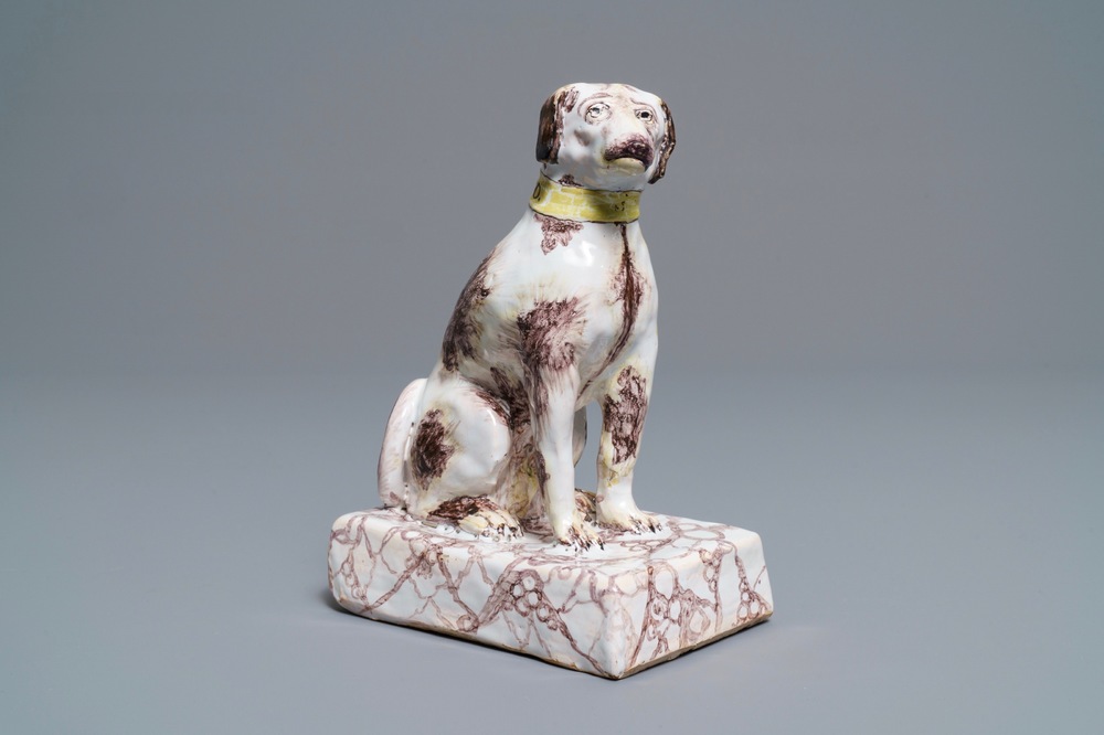 A manganese and yellow Brussels faience model of a dog, 18th C.