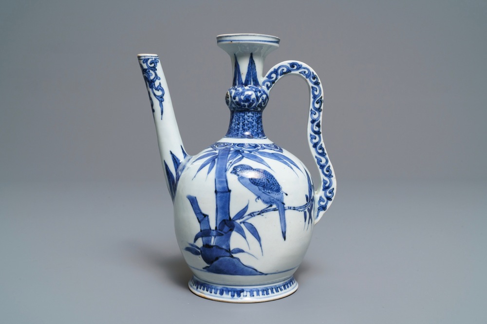 An unusual Japanese Arita blue and white jug with birds among foliage, Edo, 17th C.