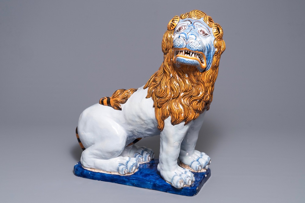 A massive French faience model of a lion, Rouen, 19th C