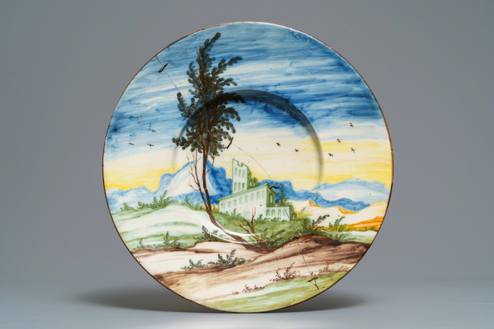 A large polychrome Italian maiolica landscape dish, Pavia, ca. 1700