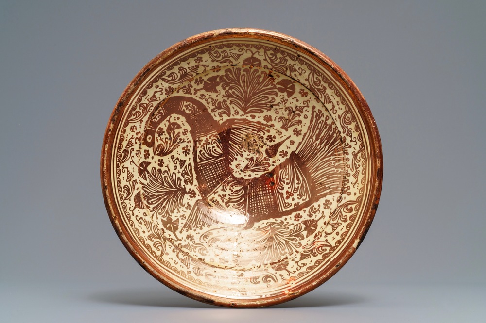 A large Hispano-Moresque lusterware charger with a bird, Valencia or Manises, Spain, 17th C.