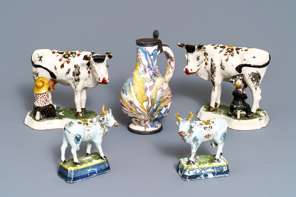 Two pairs of Dutch Delft cows and a pewter-mounted Habaner jug, 18th C.