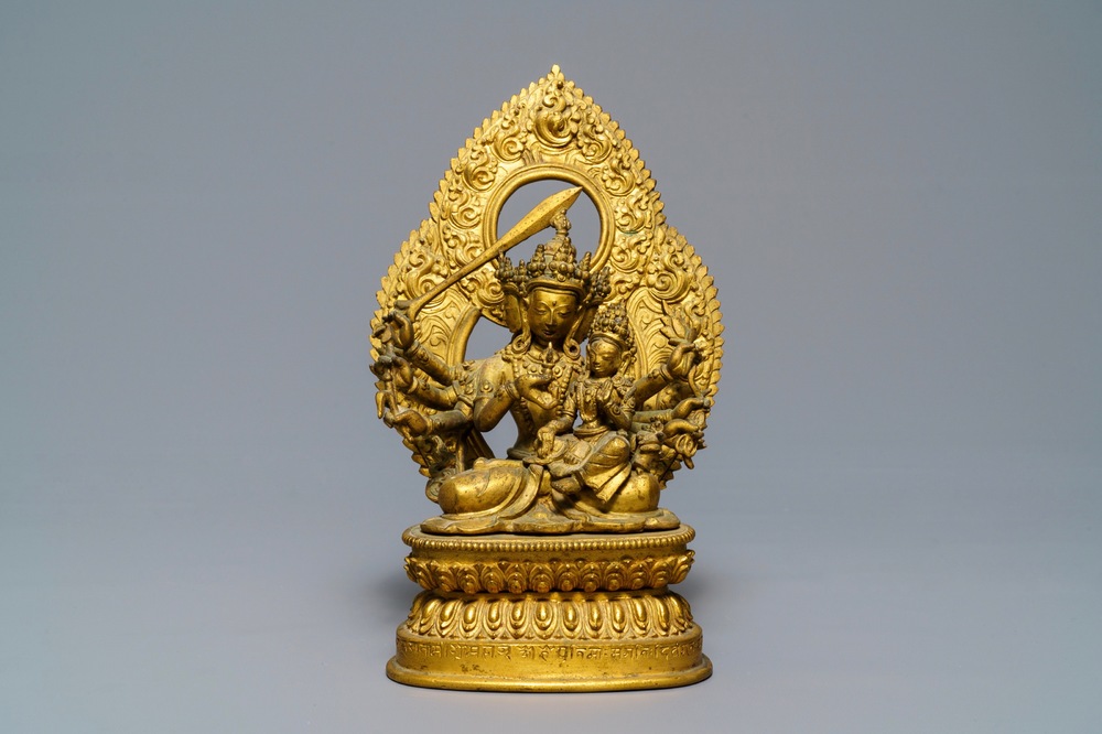 A Tibetan inscribed gilt bronze group of Manjusri and Prajnaparamita, 17/18th C.