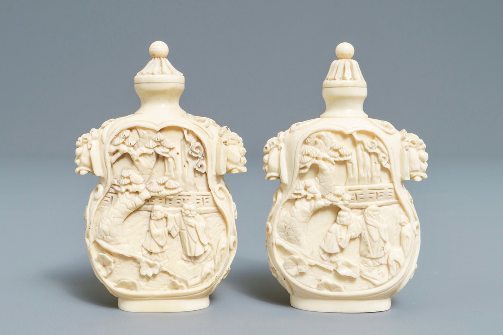 A pair of Chinese carved ivory snuff bottles, 19th C.