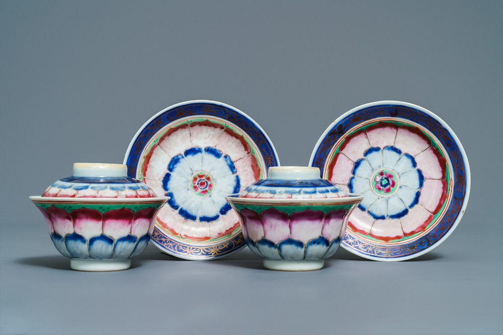 A pair of Chinese famille rose 'lotus' bowls and covers on stands, Qianlong