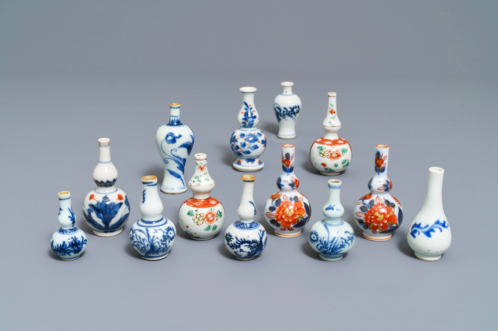 Thirteen Chinese blue and white and famille verte miniature vases, Kangxi and later