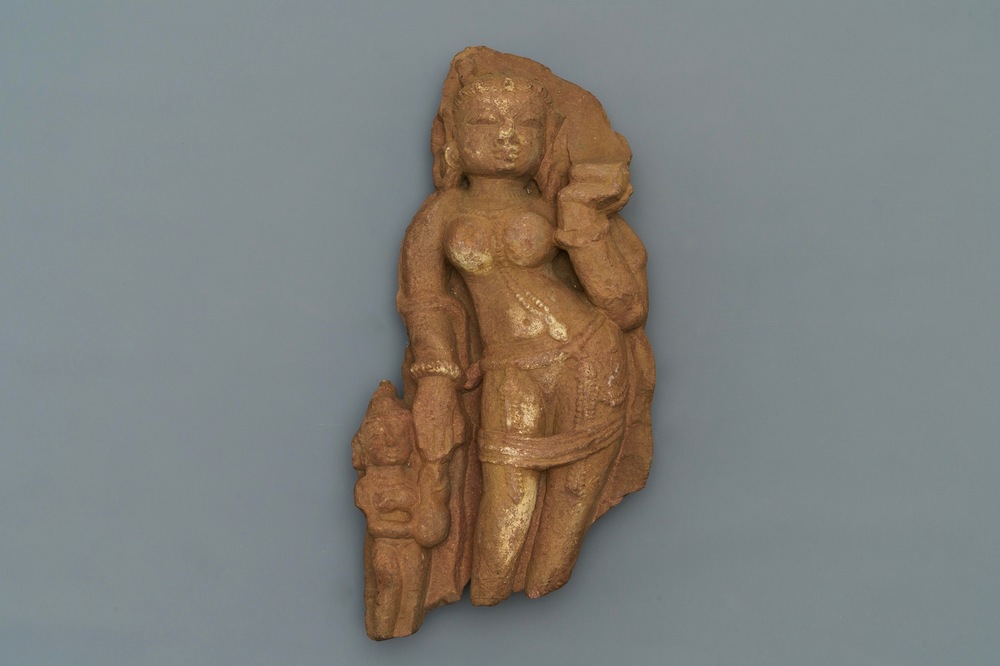 A red sandstone fragment of a Yakshi, India, 14th C. or later