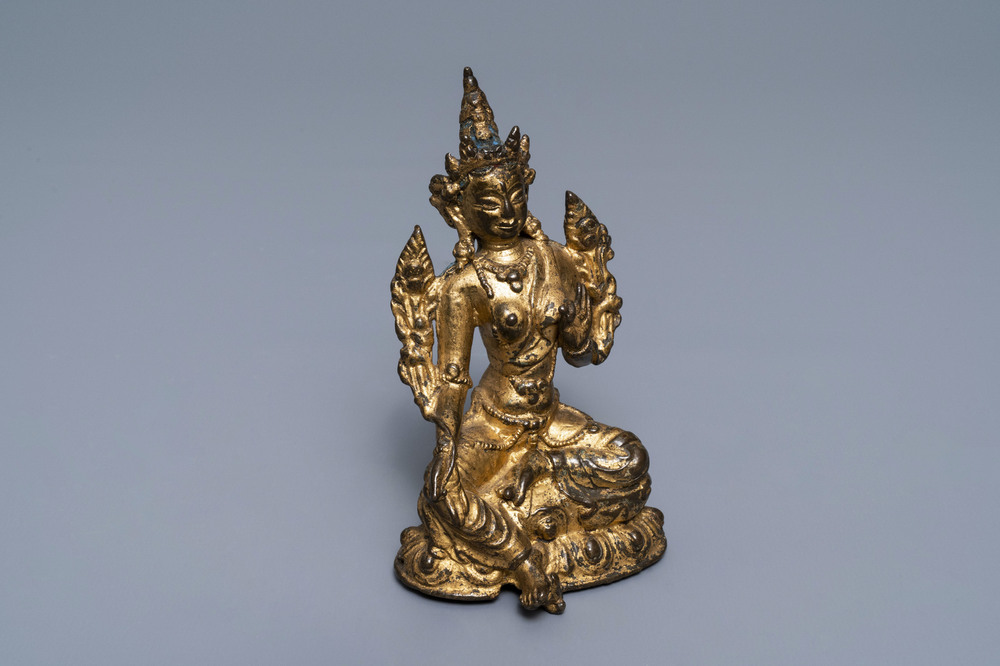 A Sino-Tibetan gilt bronze figure of Green Tara, 17/18th C.