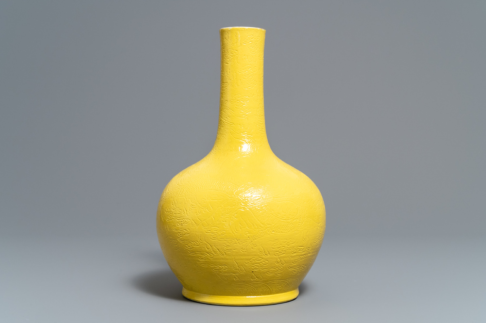 A Chinese monochrome yellow vase with underglaze dragon design 