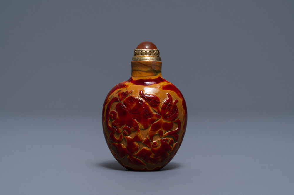 A Chinese carved realgar glass snuff bottle, Imperial Glassworks, Beijing, 1730-1840