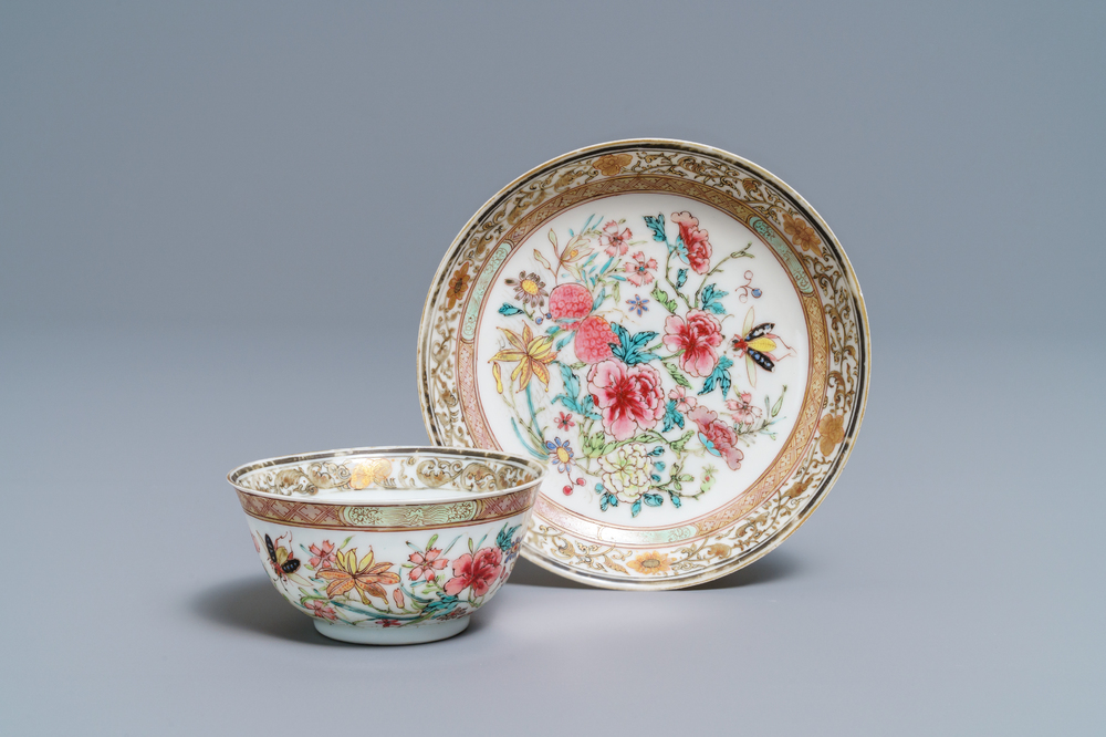 A fine Chinese famille rose cup and saucer with flowers and insects, Yongzheng