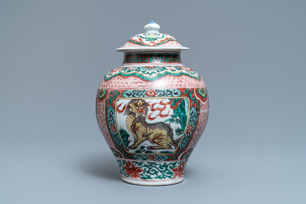 A Chinese wucai &lsquo;mythical beasts&rsquo; vase and cover, Transitional period