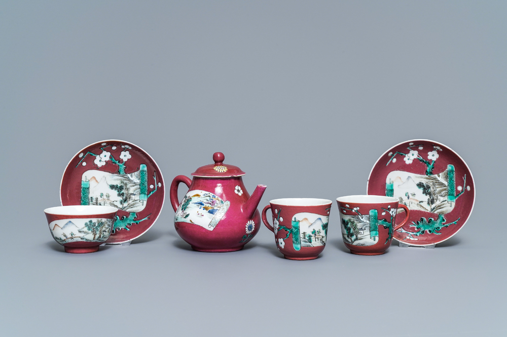 A Chinese famille rose ruby-ground teapot, three cups and two saucers, Yongzheng