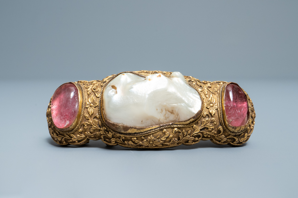 A Chinese baroque pearl and rose quartz inset gilt-bronze belt buckle, Ming