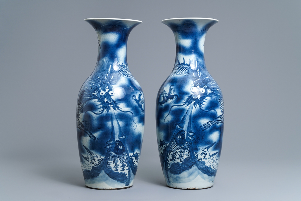 A pair of Chinese blue and white 'dragon and carp' vases, 19th C.