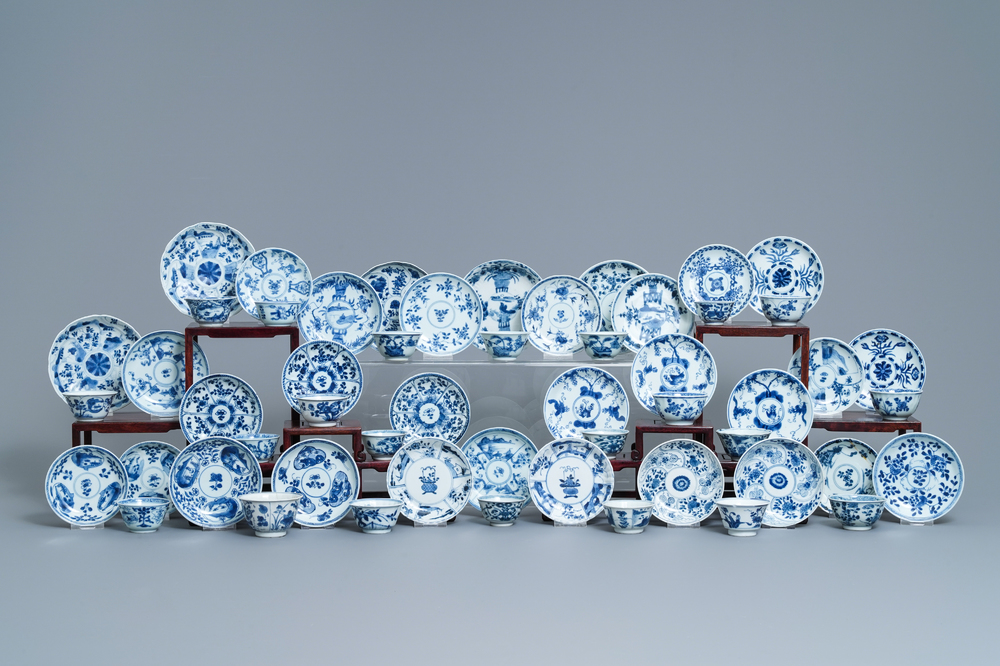 A collection of 22 Chinese blue and white cups and 32 saucers, Kangxi/Qianlong