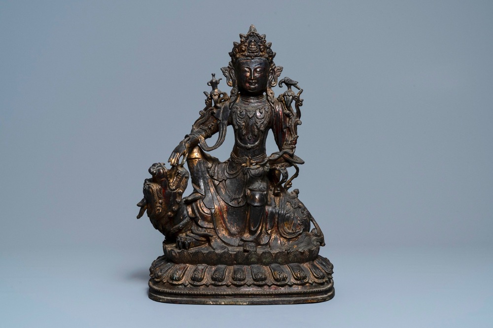 A large Chinese bronze group of Guanyin on a dragon, prob. Ming