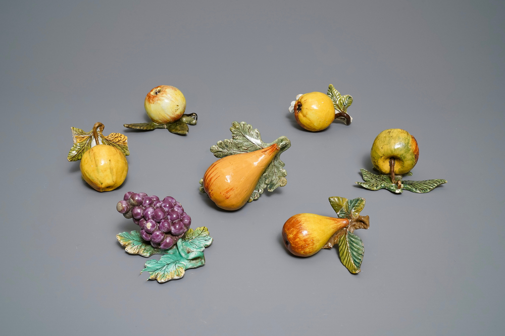 Seven polychrome Dutch Delft models of apples, grapes and pears, 18th C.