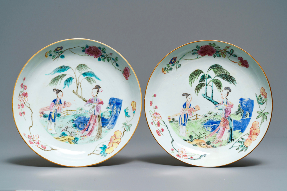 A pair of Chinese famille rose plates with ladies in a garden, Yongzheng/Qianlong