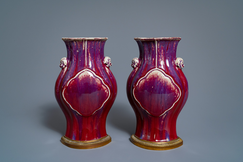 A pair of Chinese flamb&eacute;-glazed vases on gilt bronze stands, 18/19th C.