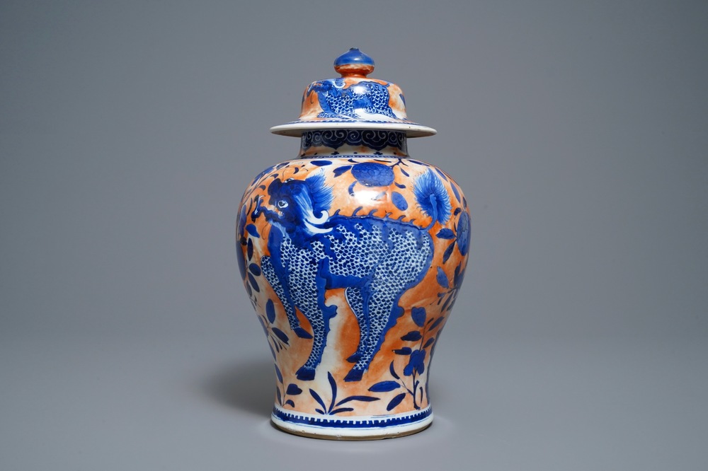 A Chinese blue and white clobbered 'qilin and phoenix' vase and cover, 19th C.