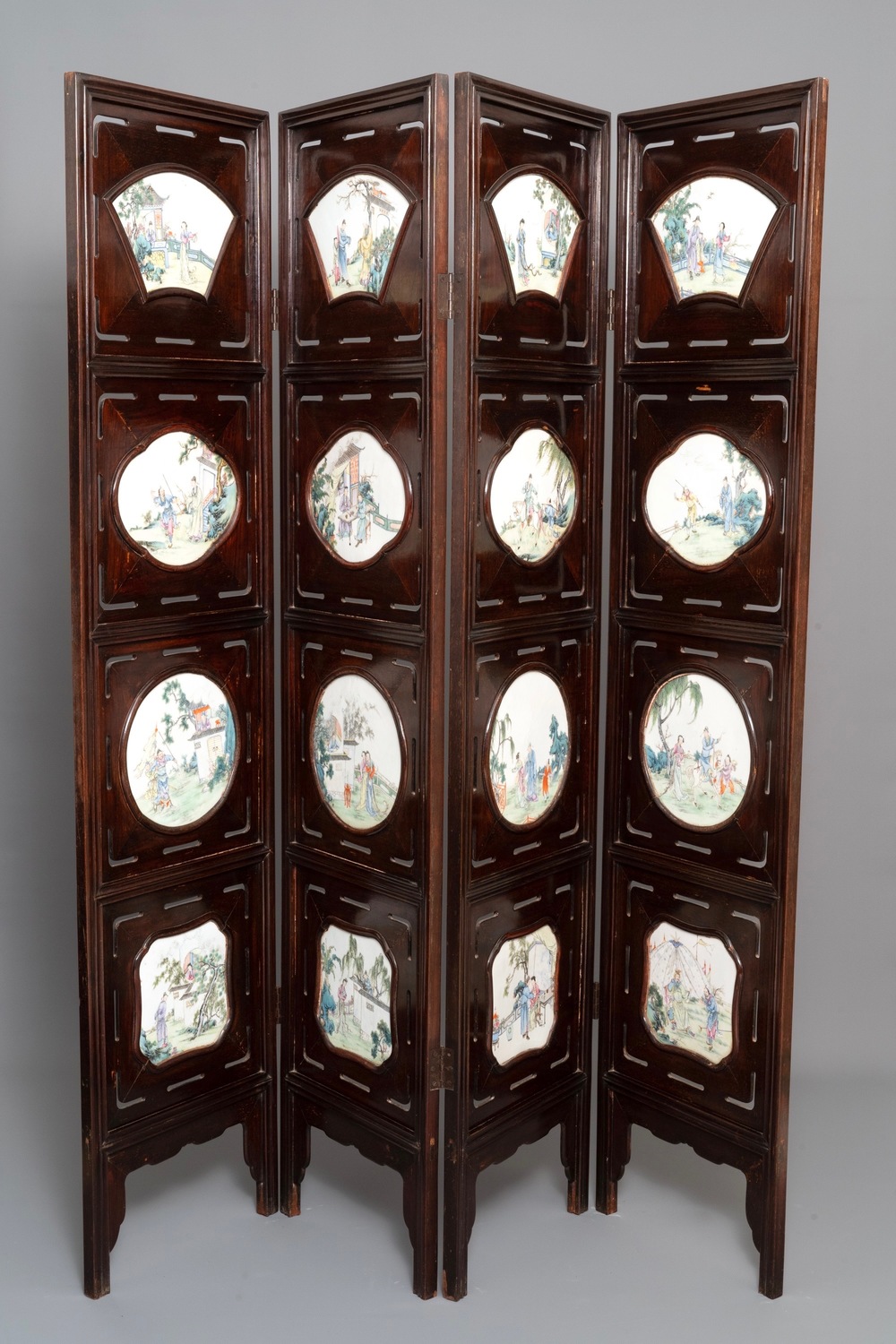 A Chinese wooden room divider with famille rose 'Romance of the Western Chamber' plaques, Republic