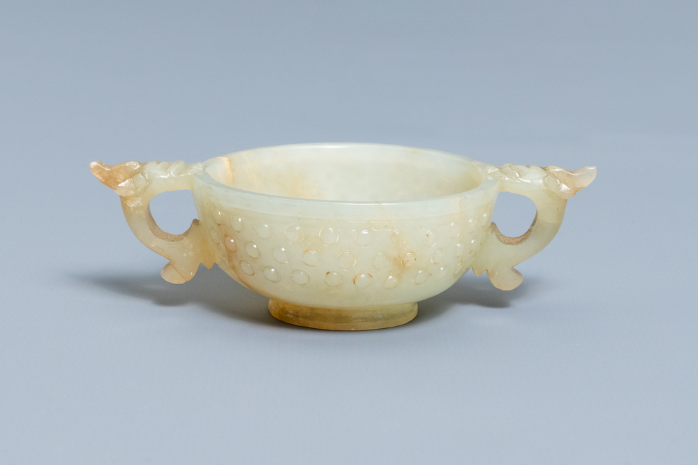 A Chinese pale celadon and russet jade two-handled bowl, prob. Ming