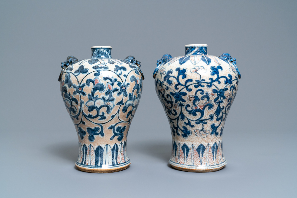 A pair of Chinese blue, white and copper-red meiping crackle-glazed vases, 19th C.