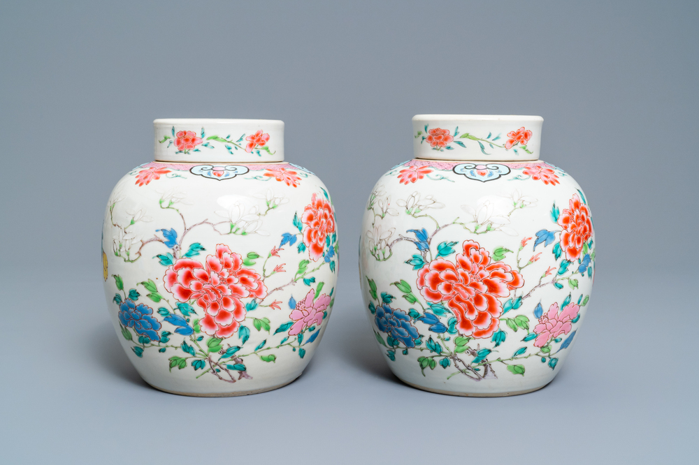 A pair of Chinese famille rose jars and covers with floral design, Yongzheng