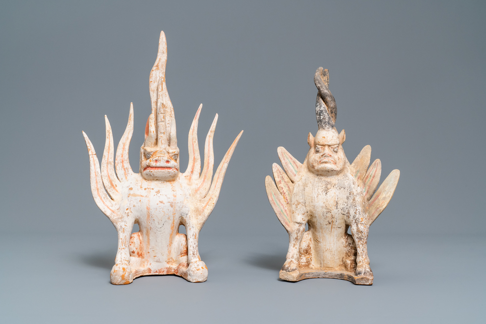 A pair of Chinese painted pottery models of 'earth spirits', Tang