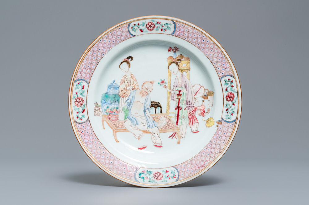 A fine Chinese famille rose ruby back plate with figures in an interior, Yongzheng