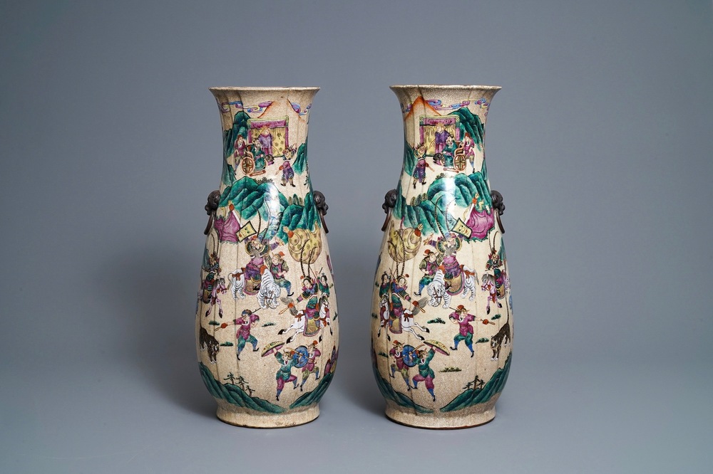 A pair of Chinese Nanking famille rose crackle-glazed 'warrior' vases, 19th C.