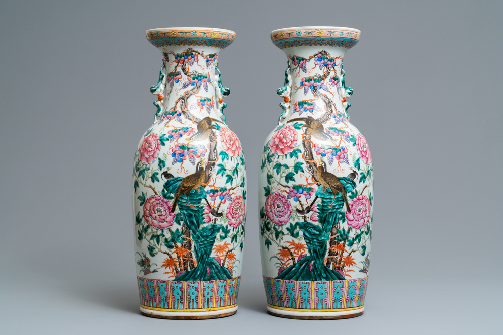 A pair of Chinese famille rose vases with birds among blossoms, 19th C.