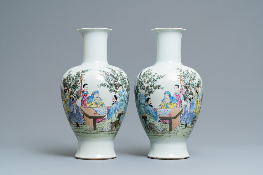 A pair of Chinese famille rose vases with go-players, Qianlong mark, 19/20th C.