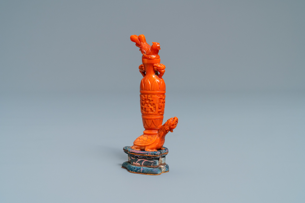 A Chinese carved red coral snuff bottle with a vase resting on a tortoise, Republic