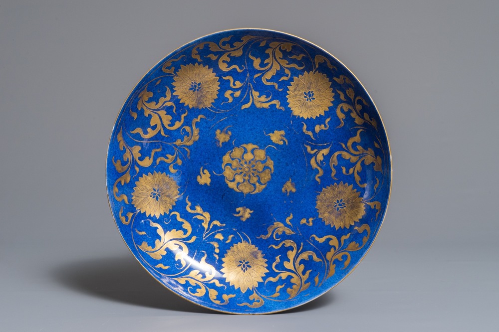 A Chinese powder blue and gilt dish with floral design, Kangxi