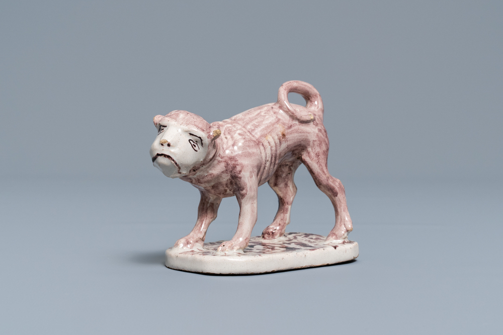 A manganese Lille faience model of a monkey, late 18th C.